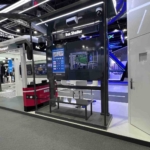 Custom exhibition stand design attracting visitors and improving event success through engaging booth layout and branding.