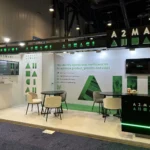 First-time exhibitor discussing exhibition booth design and budgeting with a professional exhibition stand designer.
