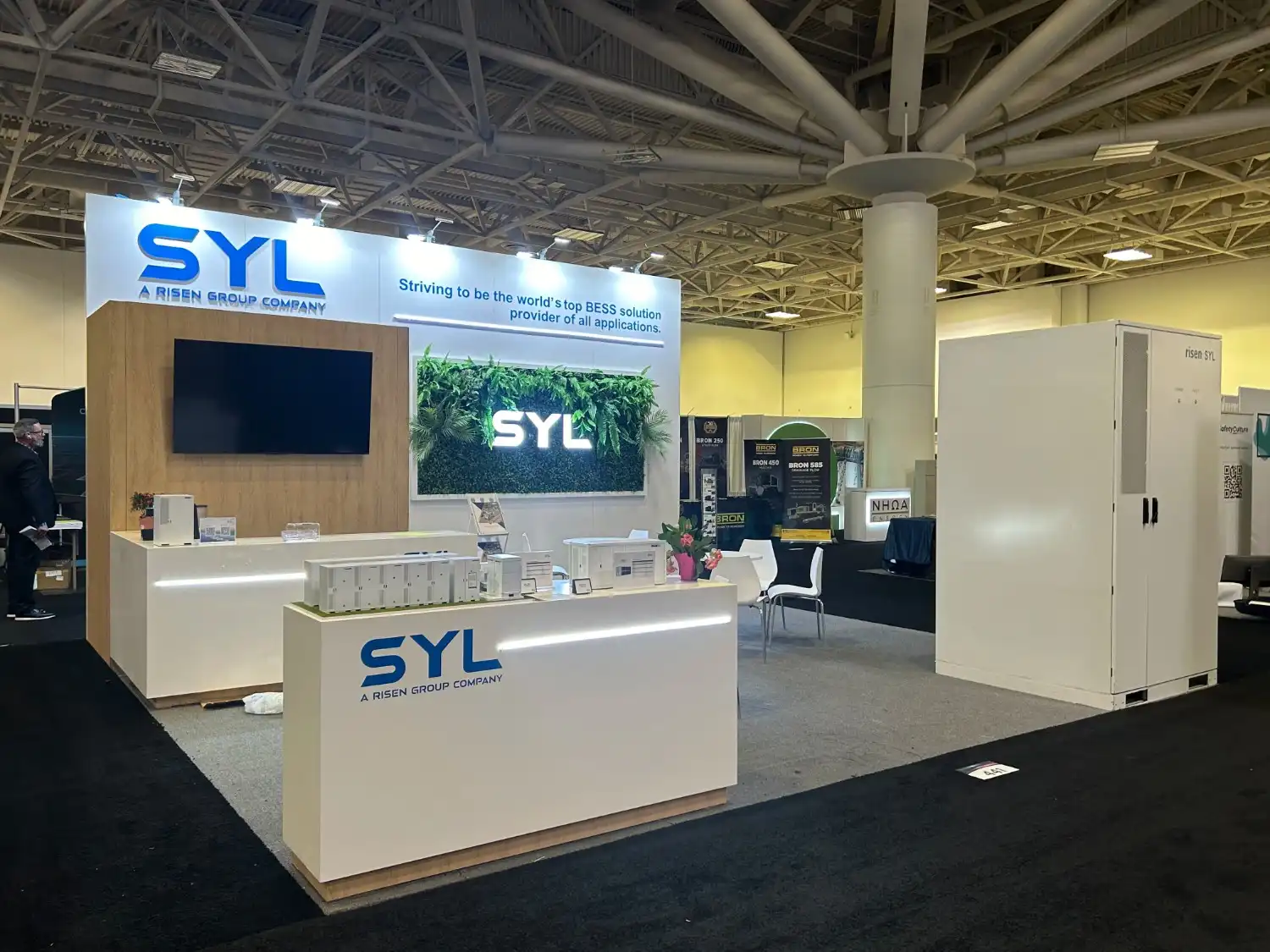 Professional exhibition booth design showcasing modern branding, interactive displays, and visitor engagement at a trade show.